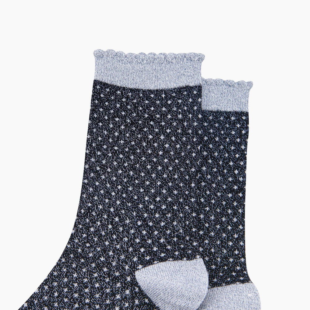 Navy blue glitter crew socks with white polka dots and scalloped grey cuffs