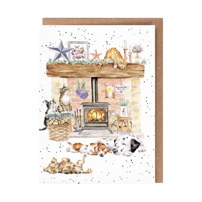Wrendale greeting card showing cozy fireplace scene with cats and dogs, brown kraft envelope