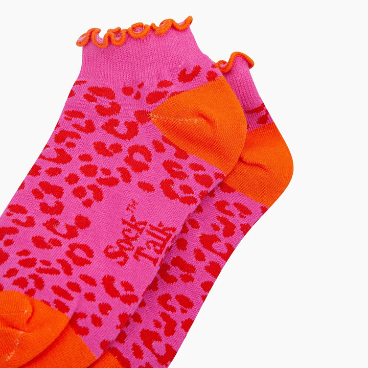 Pink leopard print trainer socks with orange frilled cuff, heel and toe by Sock Talk