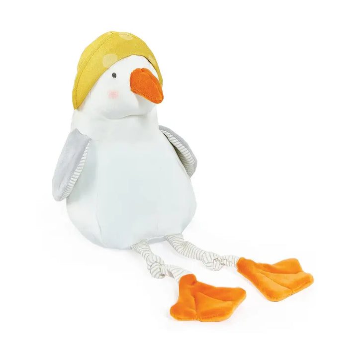 Plush white duck toy wearing yellow cap with orange beak and feet