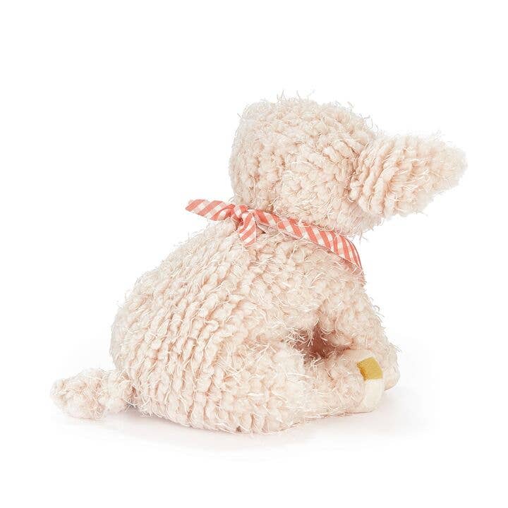 Soft pink plush bunny stuffed animal with striped bow sitting upright