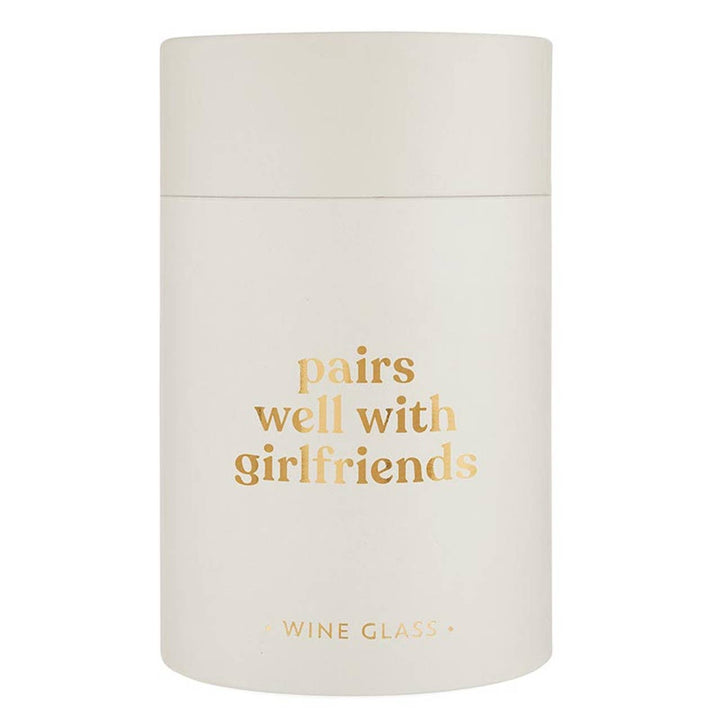 Frosted white stemless wine glass with gold text saying pairs well with girlfriends