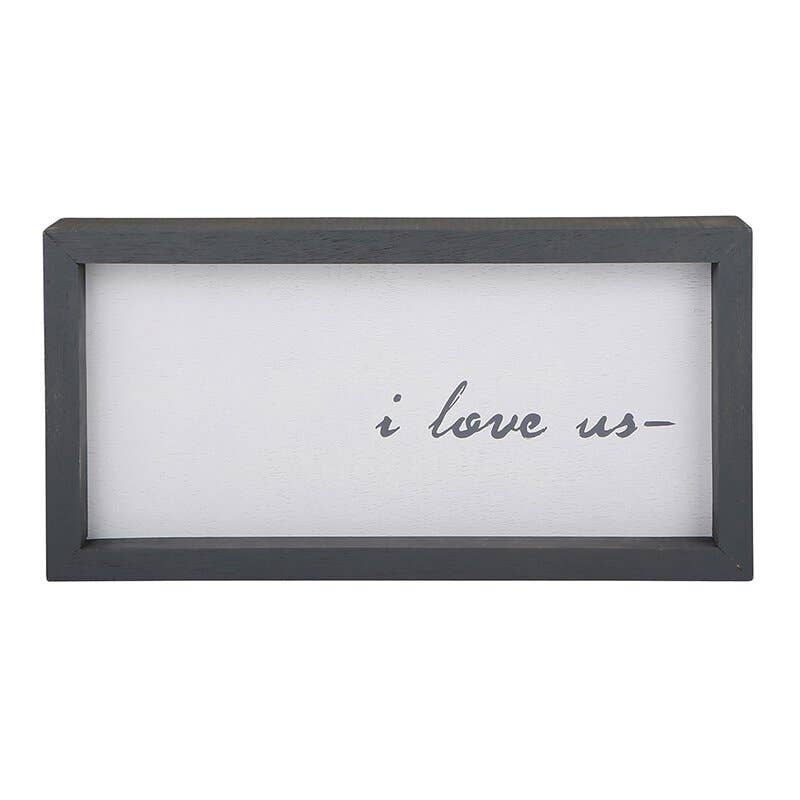 Gray wooden framed wall art with cursive text reading 'i love us'