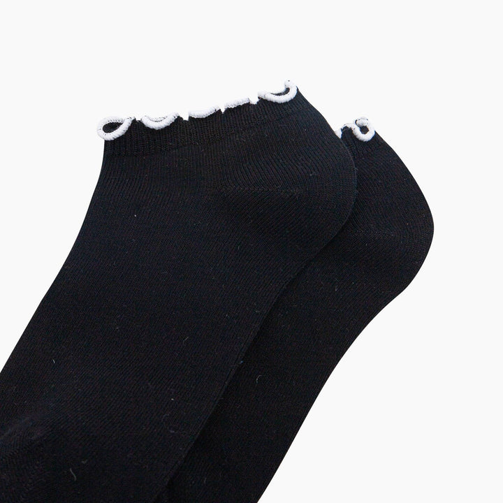 Black bamboo ankle socks with white frilly frill trim cuff, pair shown