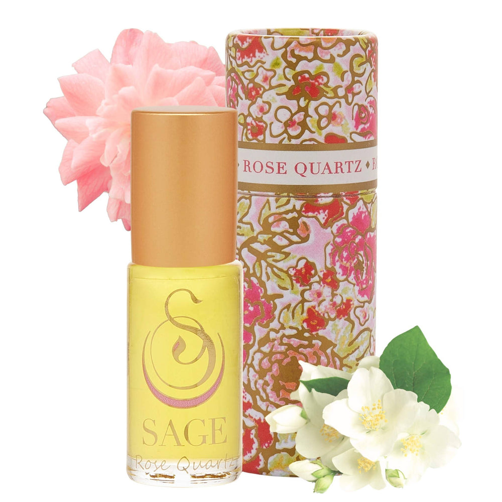 SAGE Rose Quartz perfume roller in yellow bottle with floral packaging and decorative flowers