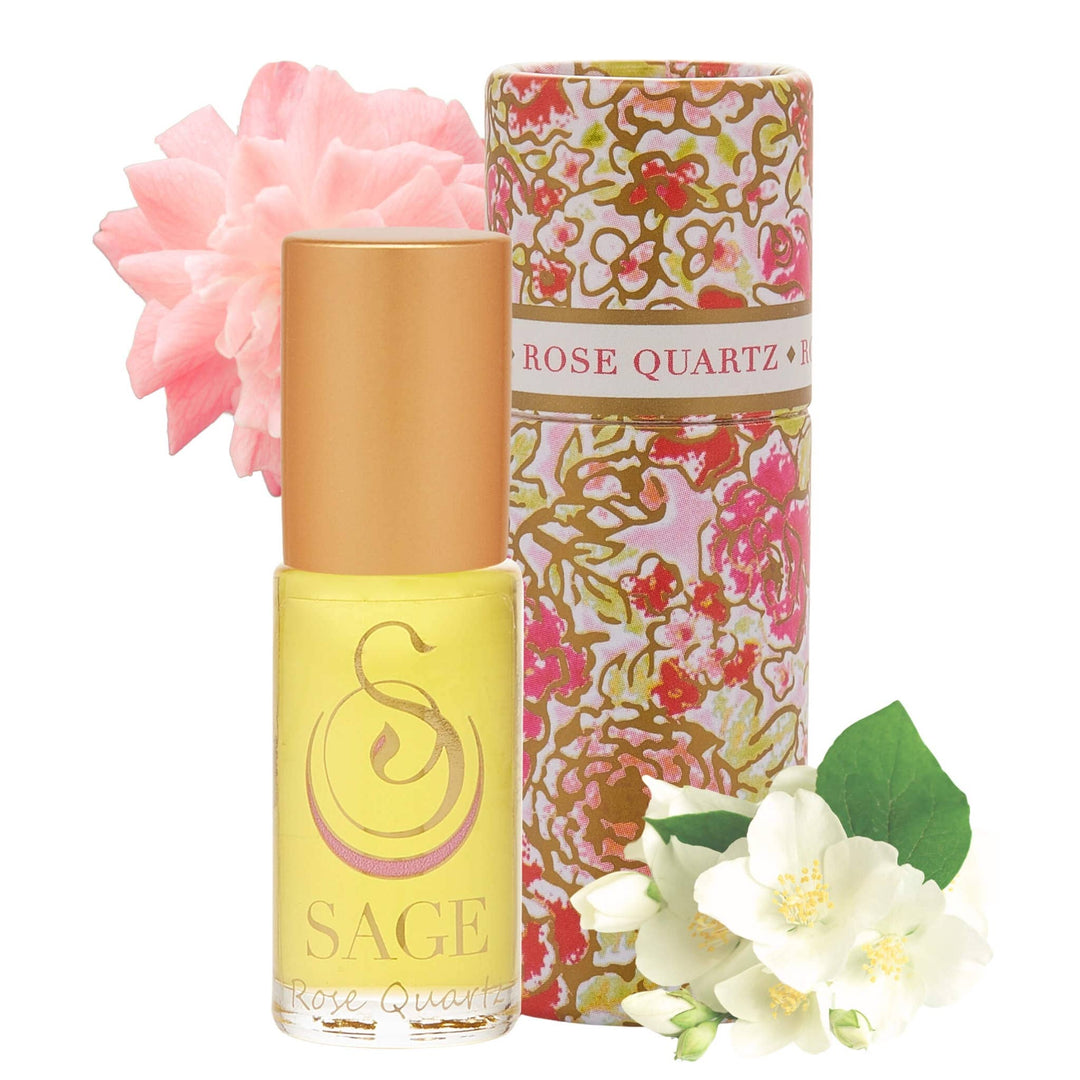 SAGE Rose Quartz perfume roller in yellow bottle with floral packaging and decorative flowers