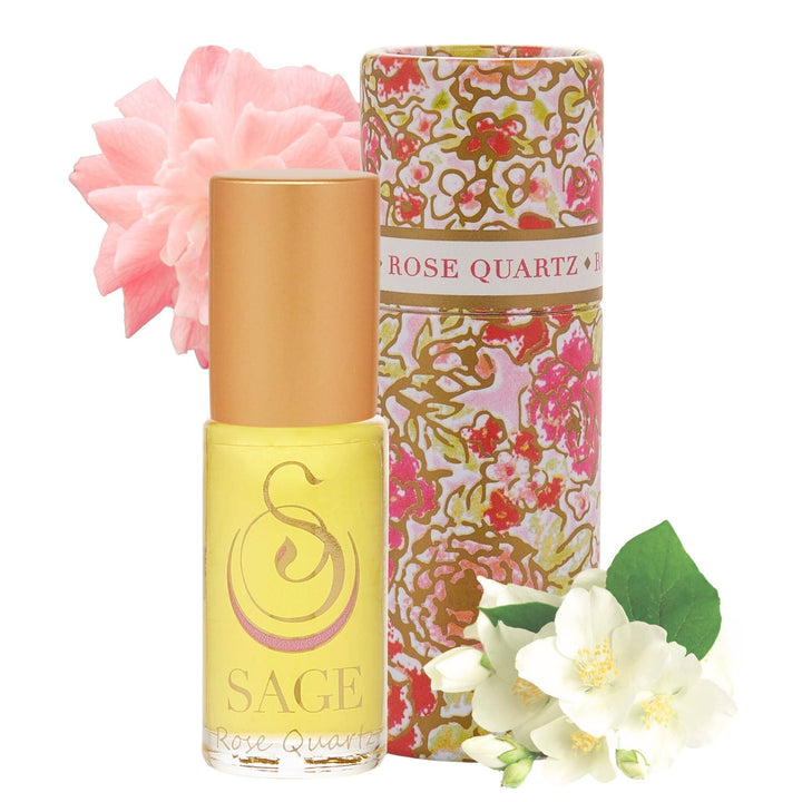 SAGE Rose Quartz perfume roller in yellow bottle with floral packaging and decorative flowers