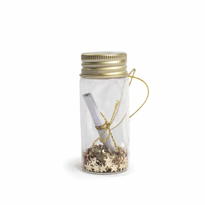Clear glass wishing bottle ornament with gold lid, star confetti, and rolled paper scroll inside