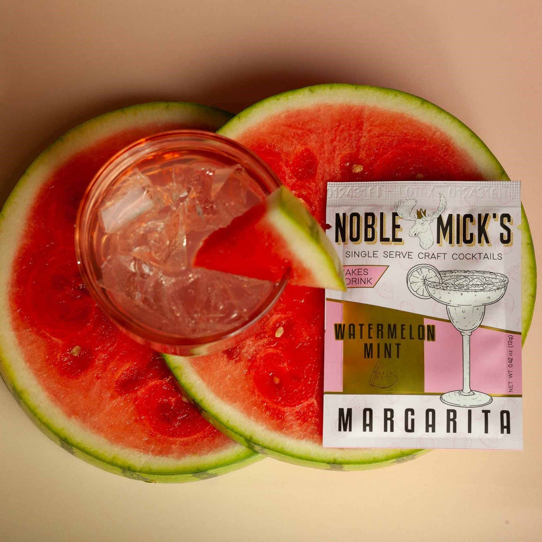 Noble Mick's Watermelon Mint Margarita single serve craft cocktail packet with fresh watermelon slices