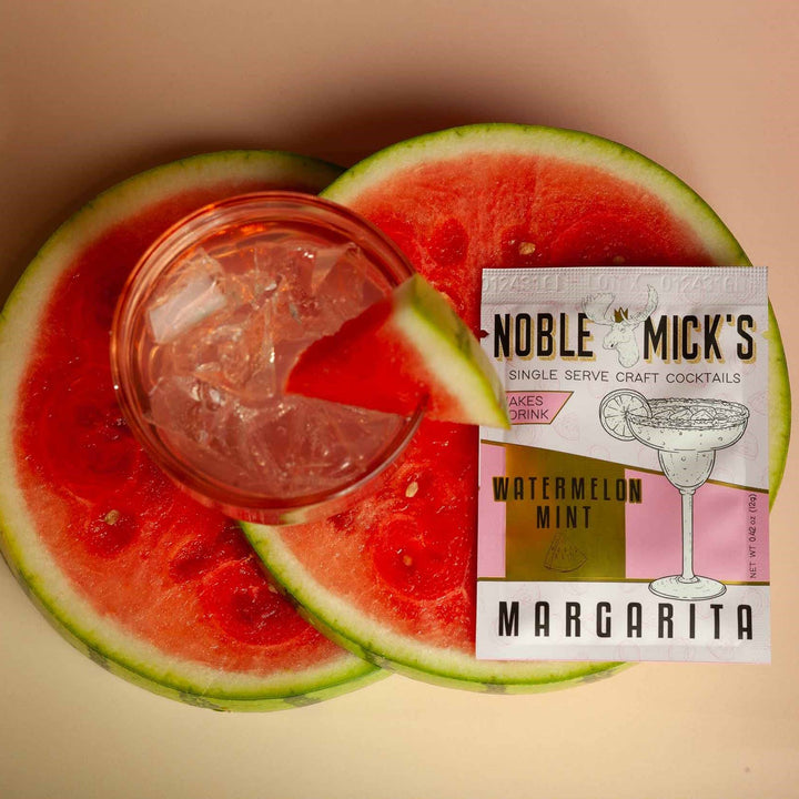Noble Mick's Watermelon Mint Margarita single serve craft cocktail packet with fresh watermelon slices