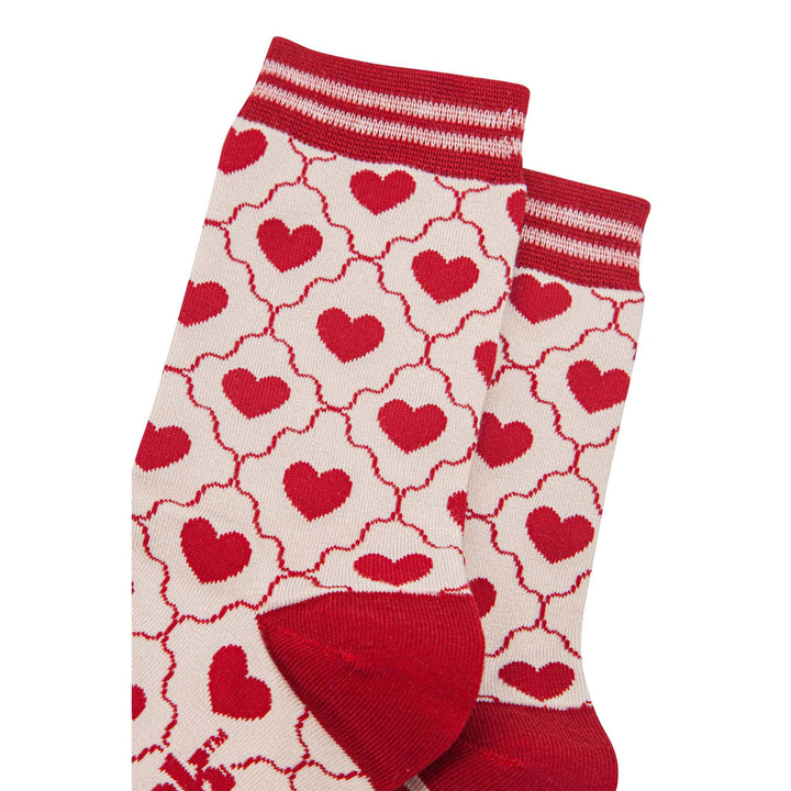 Cream bamboo crew socks with red heart pattern and striped red cuff