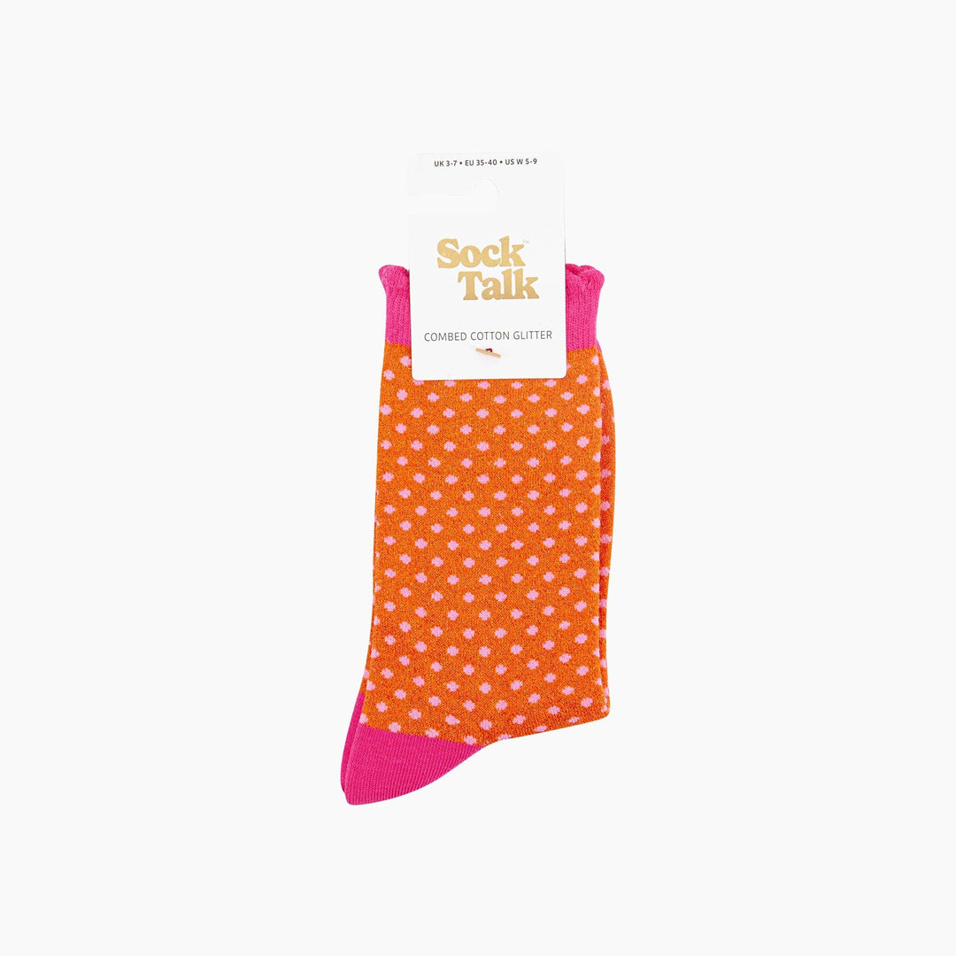 Orange glitter crew socks with pink polka dots and hot pink cuffs, heel and toe