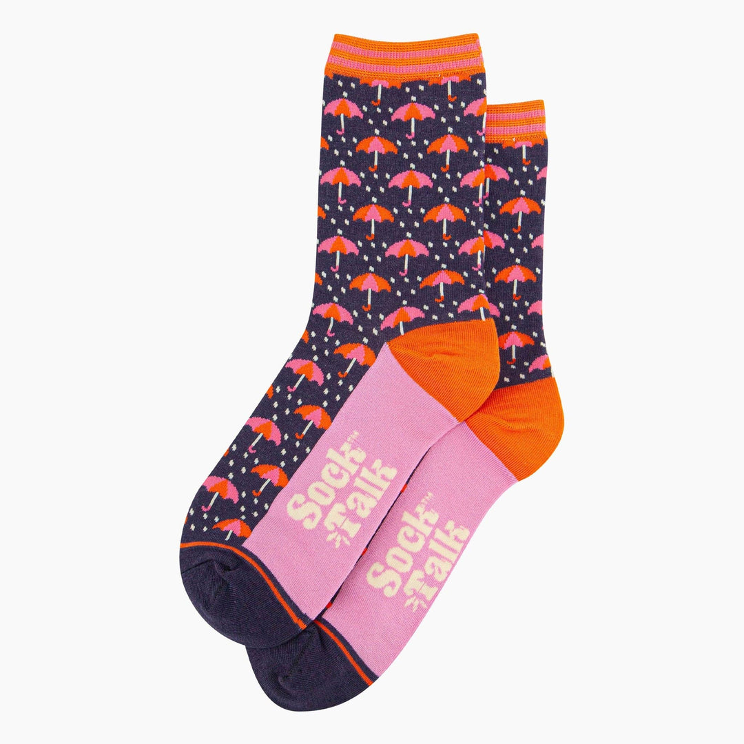 Navy blue bamboo crew socks with pink orange umbrella pattern and pink sole