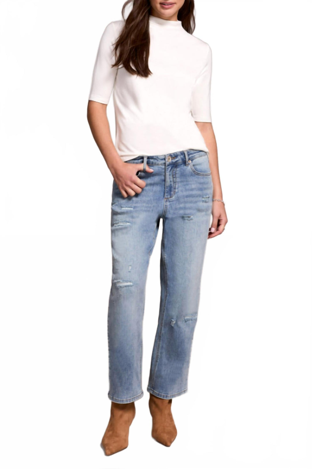Woman wearing light blue distressed straight leg cropped jeans with white turtleneck