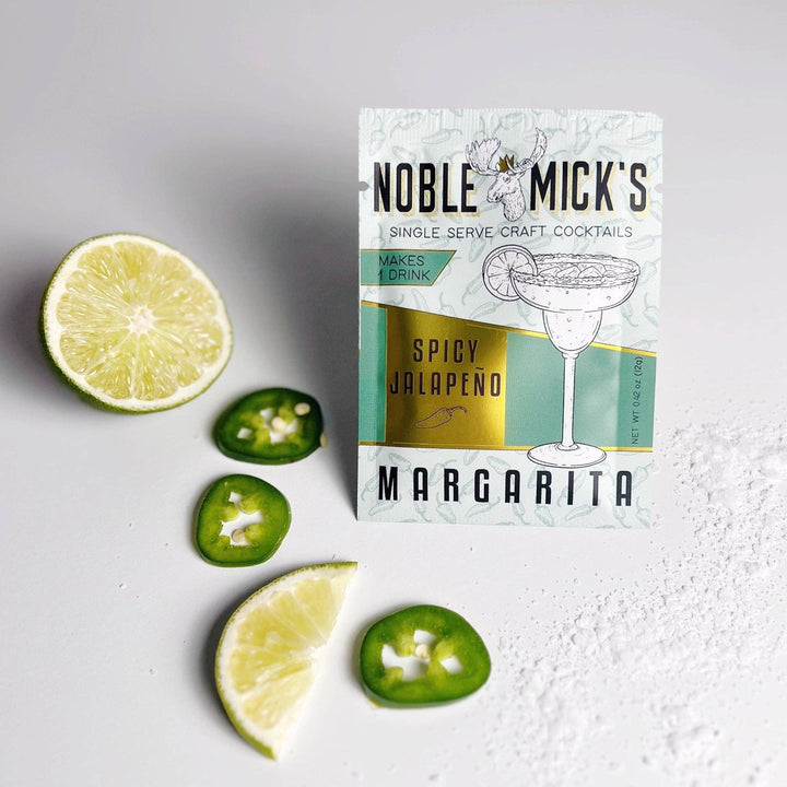 Noble Mick's Spicy Jalapeño Margarita single serve craft cocktail packet with fresh limes and jalapeños
