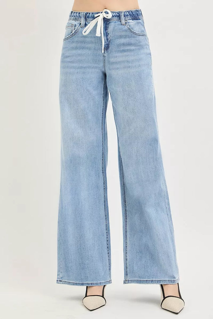 Light blue wide leg jeans with drawstring waistband on model