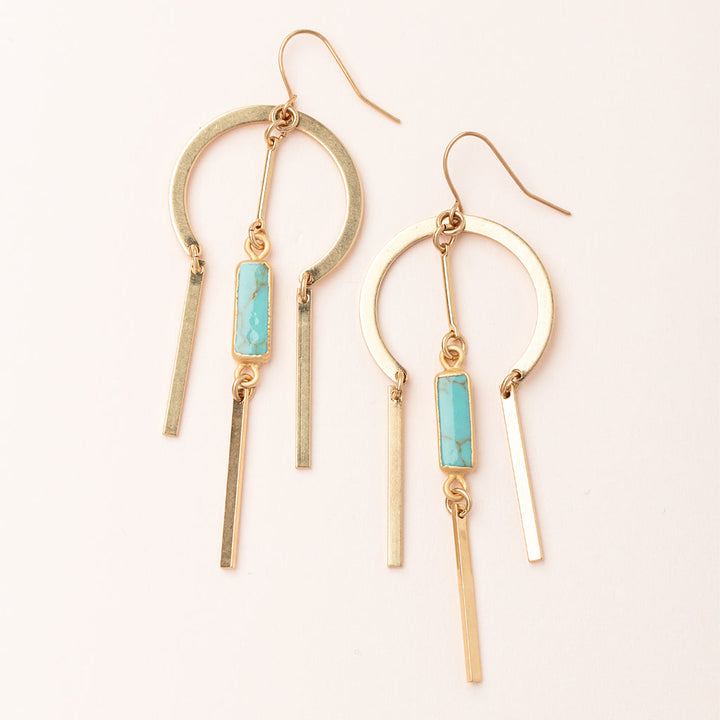 Gold drop earrings with circular hoops, turquoise stone bars, and dangling metal strips