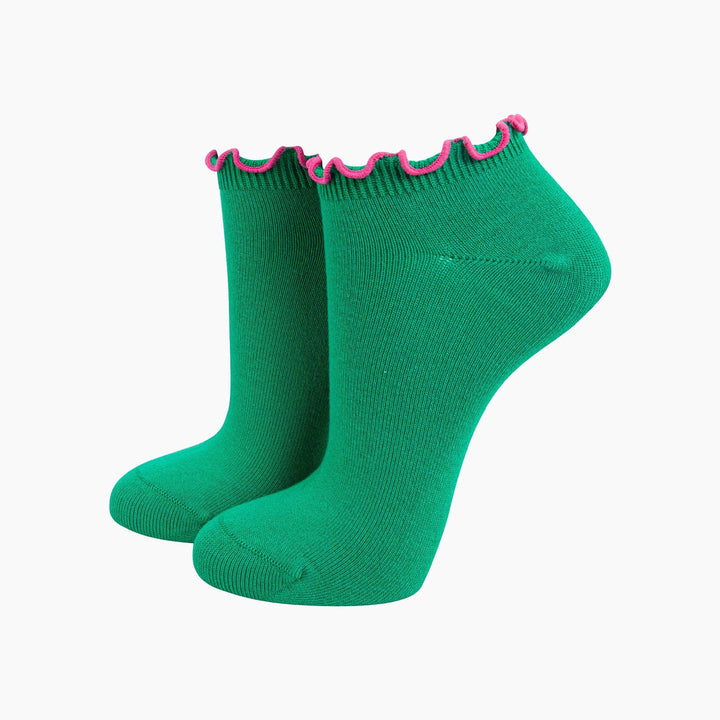 Green bamboo ankle trainer socks with pink frilly ruffle trim at cuff