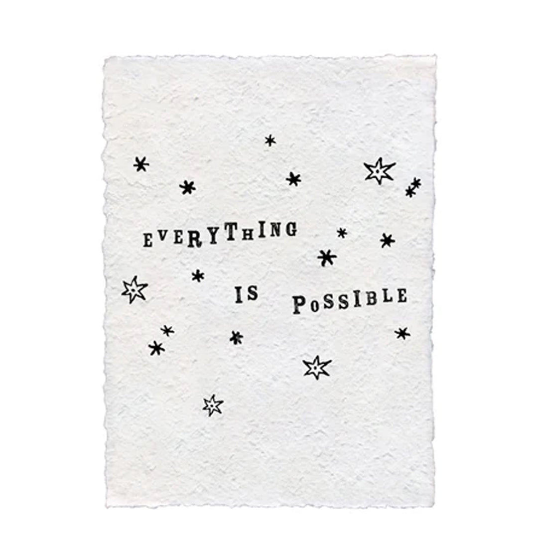 Handmade textured white paper print reading 'Everything Is Possible' with black star decorations