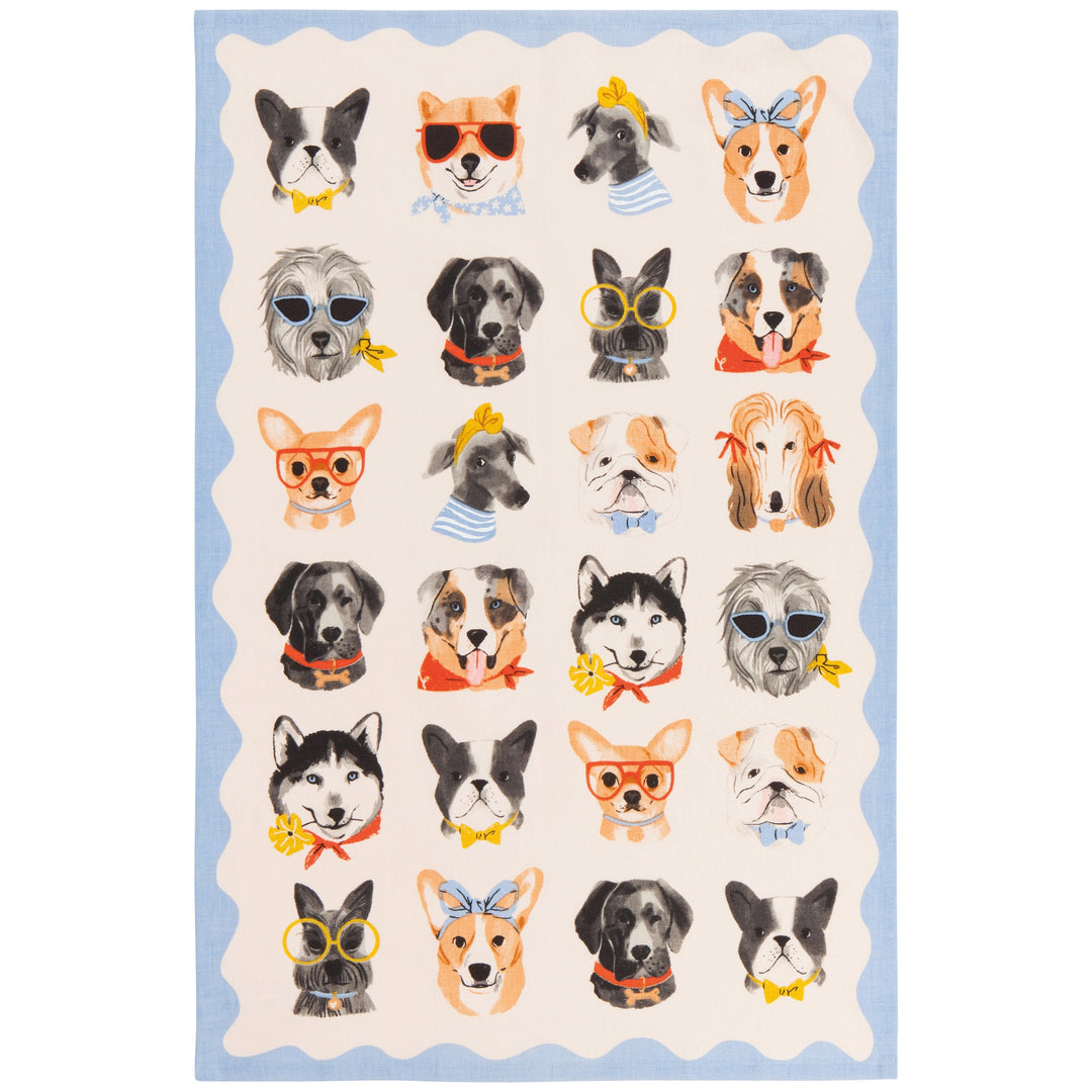Danica kitchen towel with illustrated dog portraits in various accessories on cream background