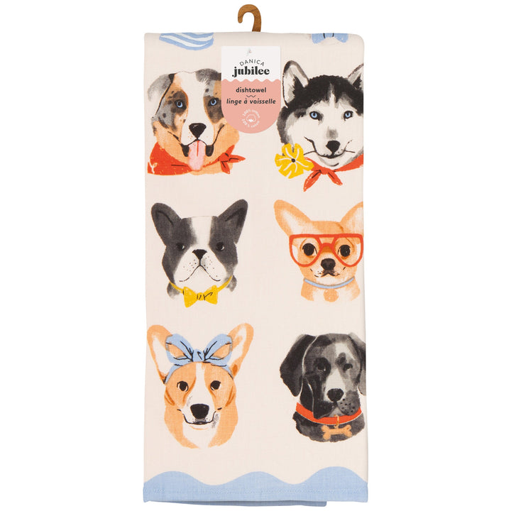Danica Jubilee dish towel featuring illustrated dog faces with colorful accessories on cream background