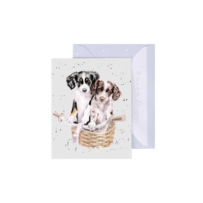 Wrendale greeting card featuring illustrated puppies in wicker basket with envelope