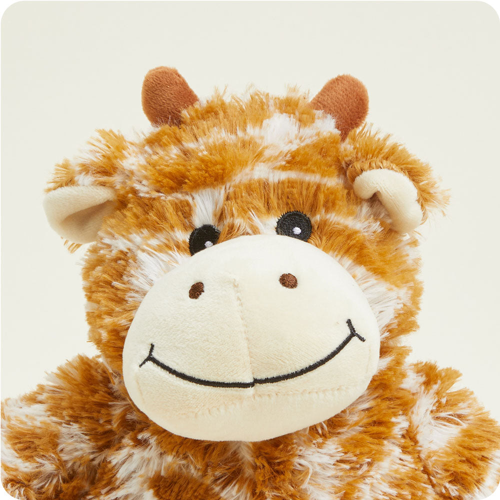 Warmies plush giraffe stuffed animal with orange spotted pattern and smiling face