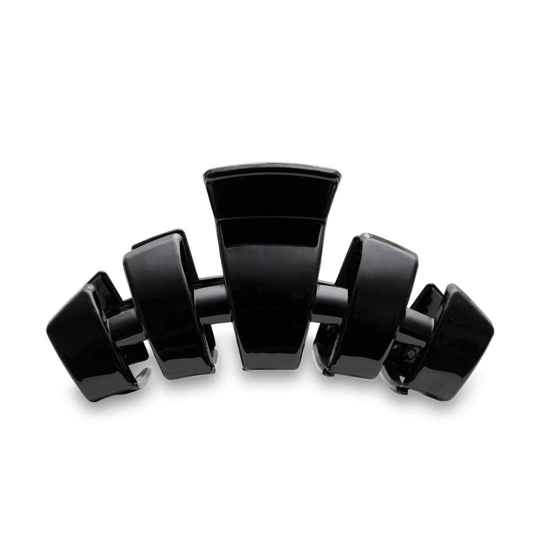 Teleties large black claw clip hair accessory with multiple interlocking teeth on teal background