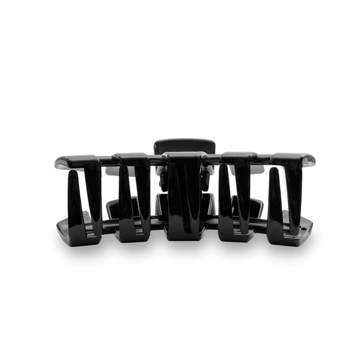 Teleties large black claw clip hair accessory with multiple prongs on teal background