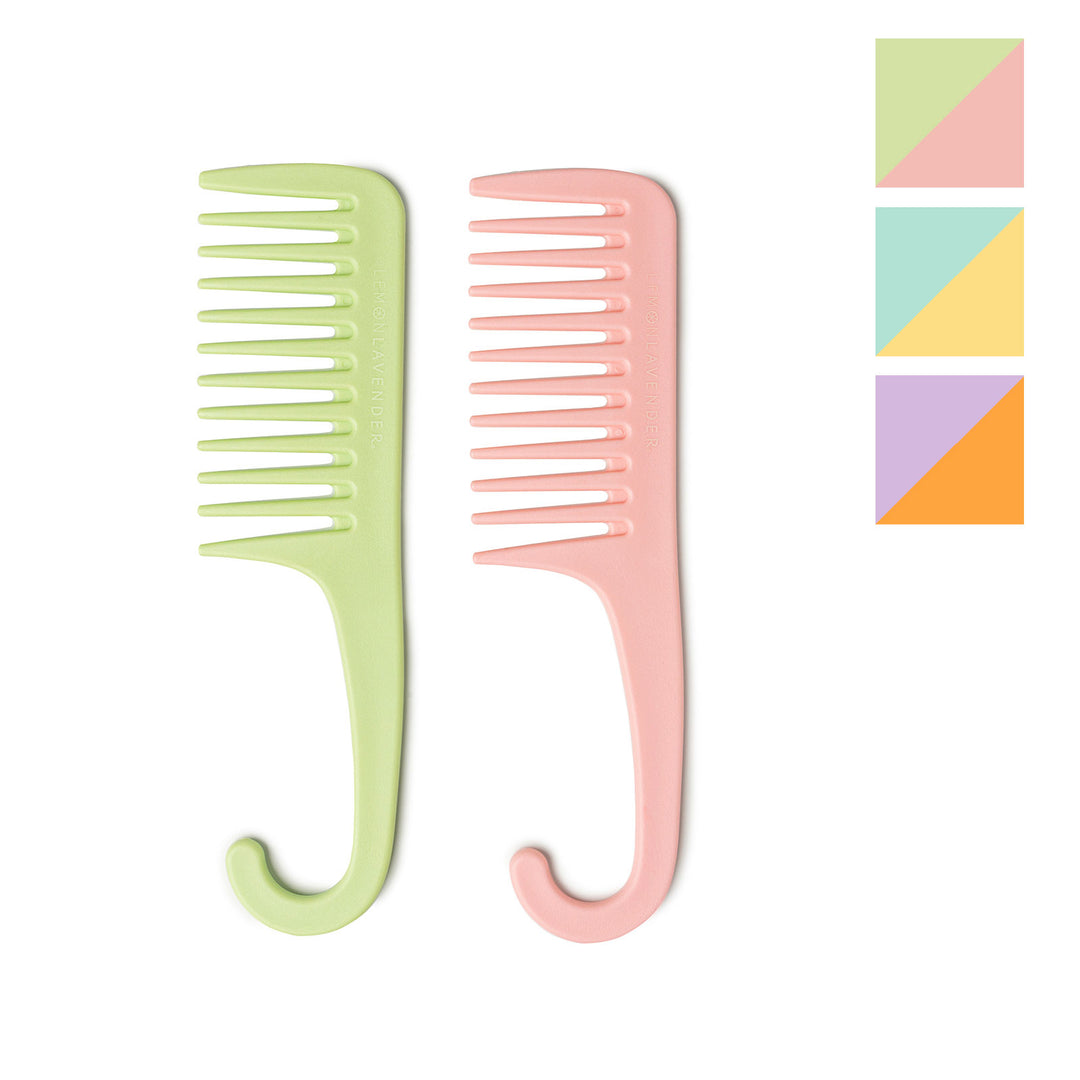Two detangling shower combs in green and pink with wide-tooth design and curved handles