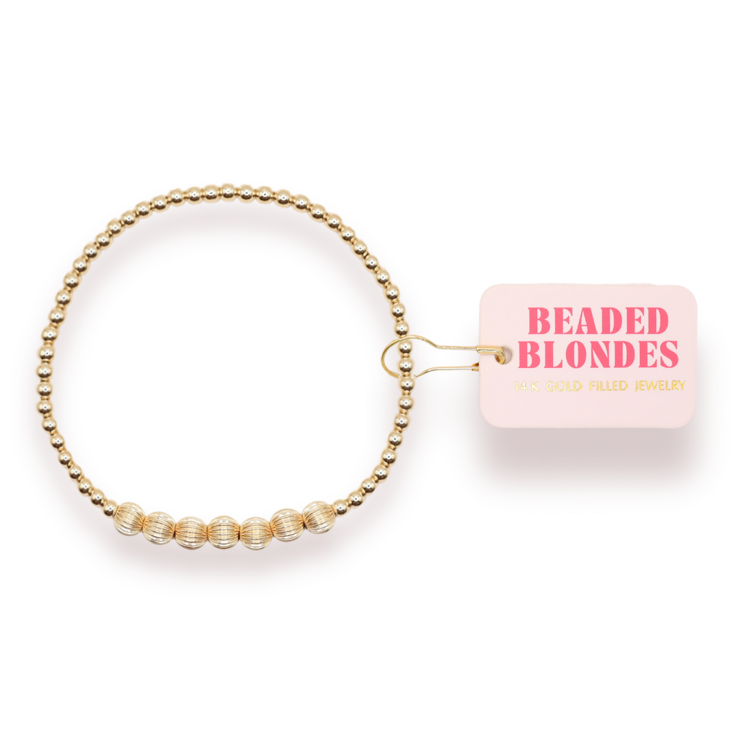Beaded Blondes Lucky Fluted Bracelet in gold-filled beads with ribbed accent beads on packaging card.