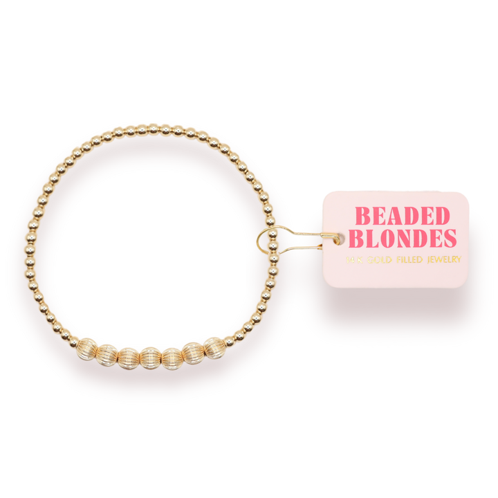 Beaded Blondes Lucky Fluted Bracelet in gold-filled beads with ribbed accent beads on packaging card.