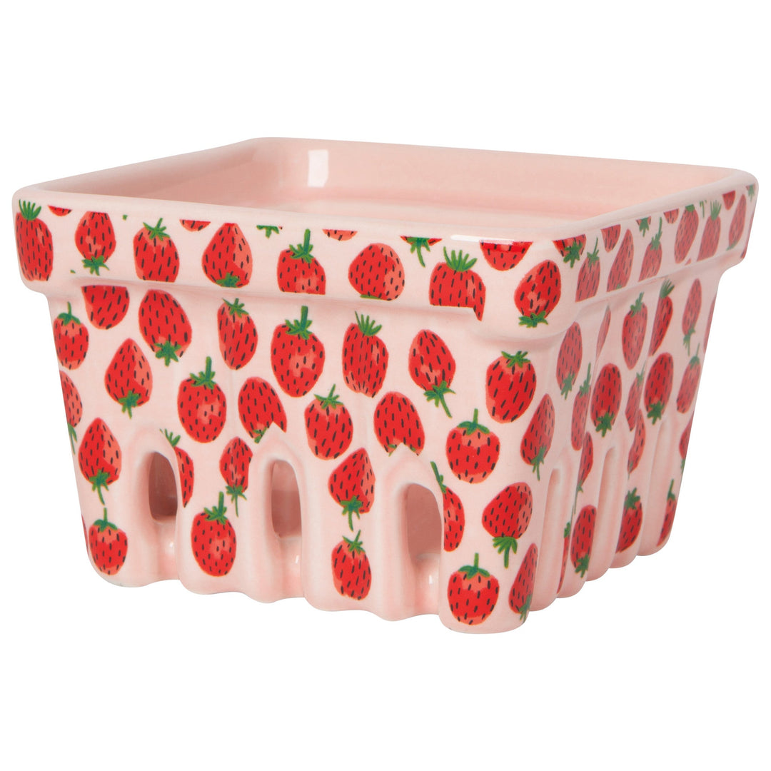 Pink ceramic berry basket with red strawberry pattern and scalloped edges