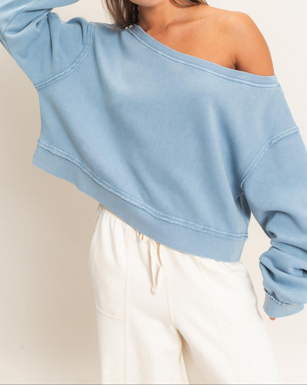 HYFVE raw edge off the shoulder cropped sweatshirt in dusty blue with visible seam details