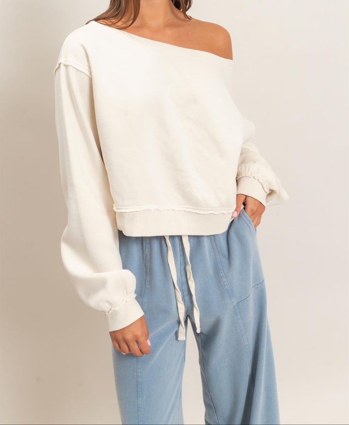 HYFVE Raw Edge Off the Shoulder Sweatshirt in cream alpaca color, cropped fit with long sleeves