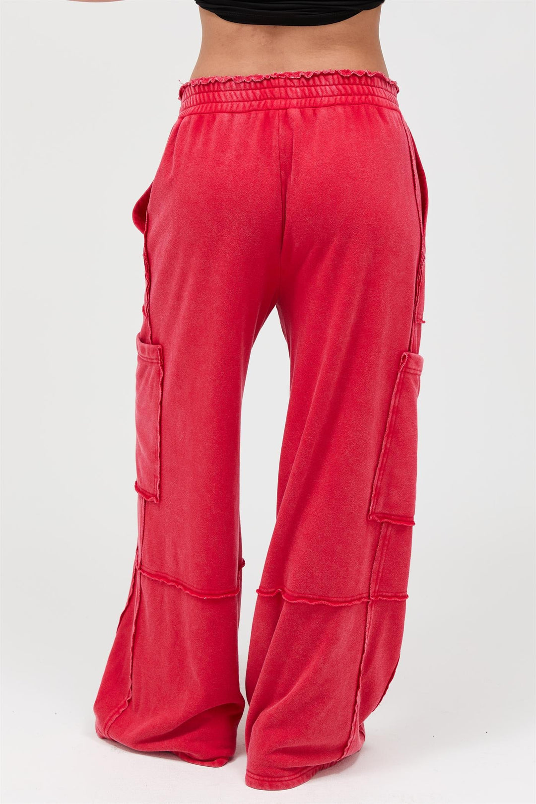 Red mineral wash wide leg cargo pants with distressed seaming details