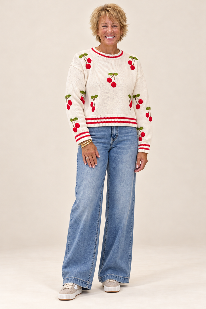 Playful Knit Sweater front view styled with relaxed wide-leg jeans