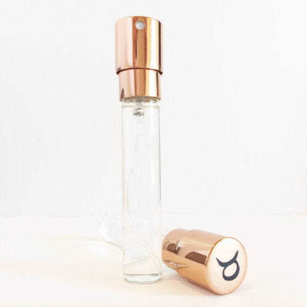 Zodica Perfumery Twist &amp; Spritz refillable perfume atomizer in rose gold with Taurus zodiac symbol
