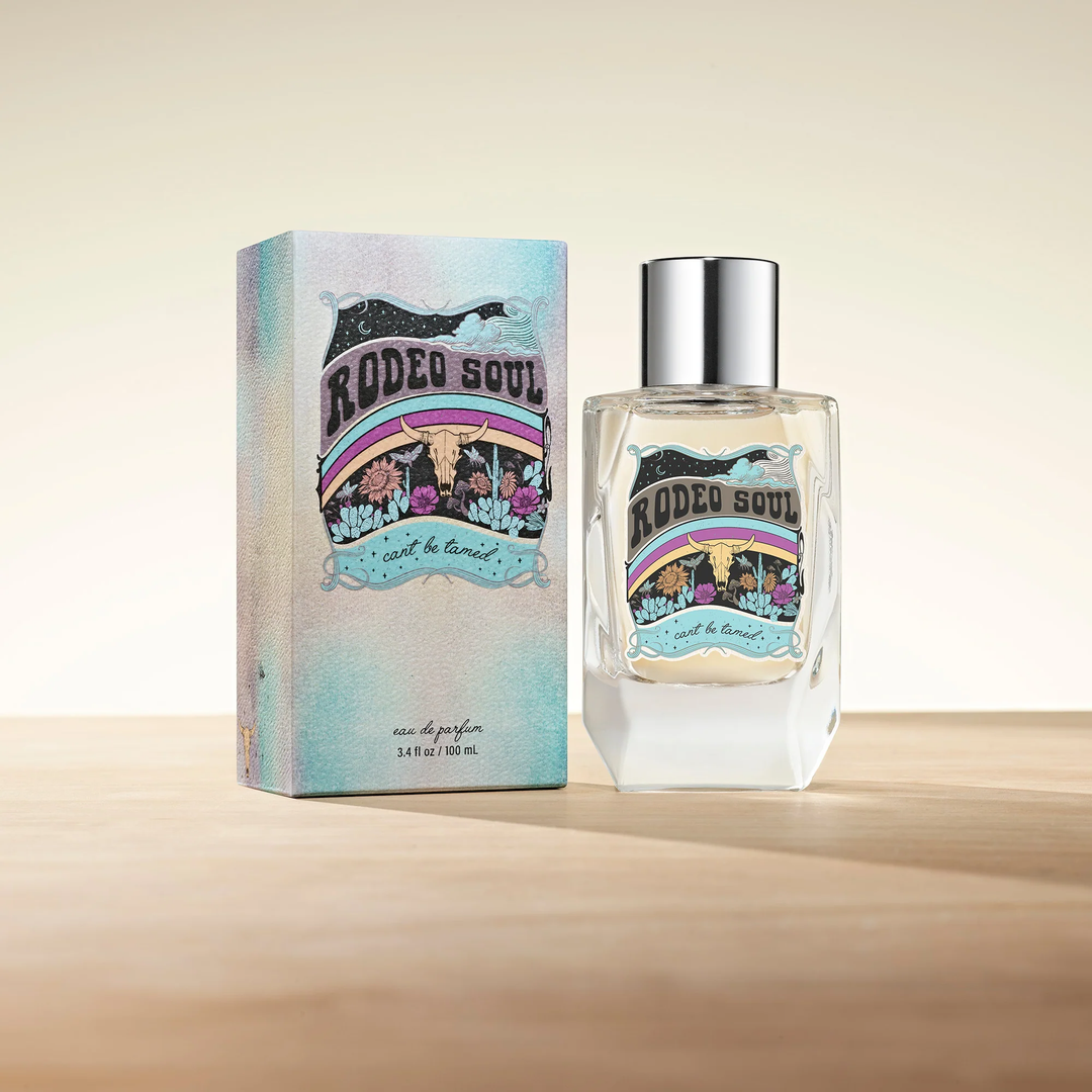 Rodeo Soul eau de parfum bottle with holographic box featuring western skull and rainbow design