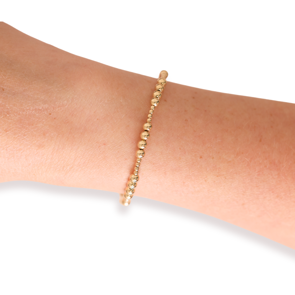 Beaded Blondes Scottie Bracelet in gold beads worn on a wrist