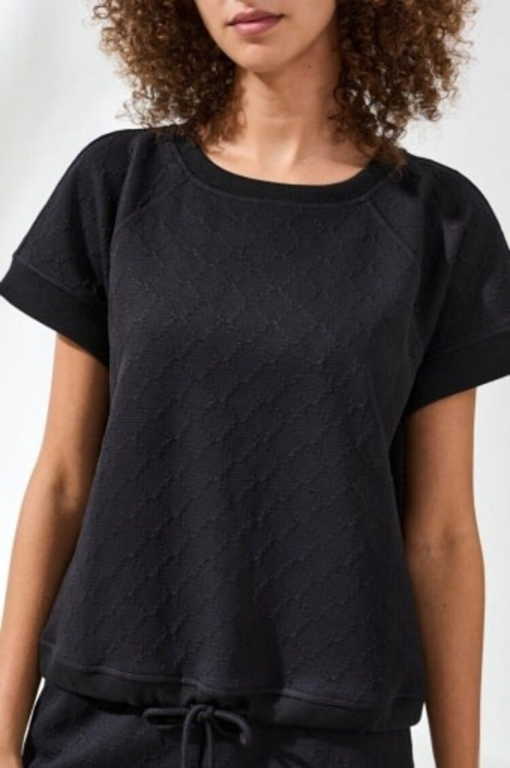 Black crew neck top with short sleeves and drawcord hem detail