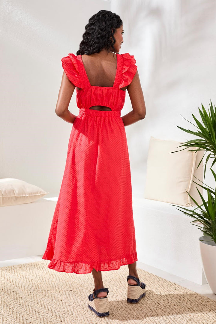 Red maxi dress with ruffled shoulders and cutout back detail on model