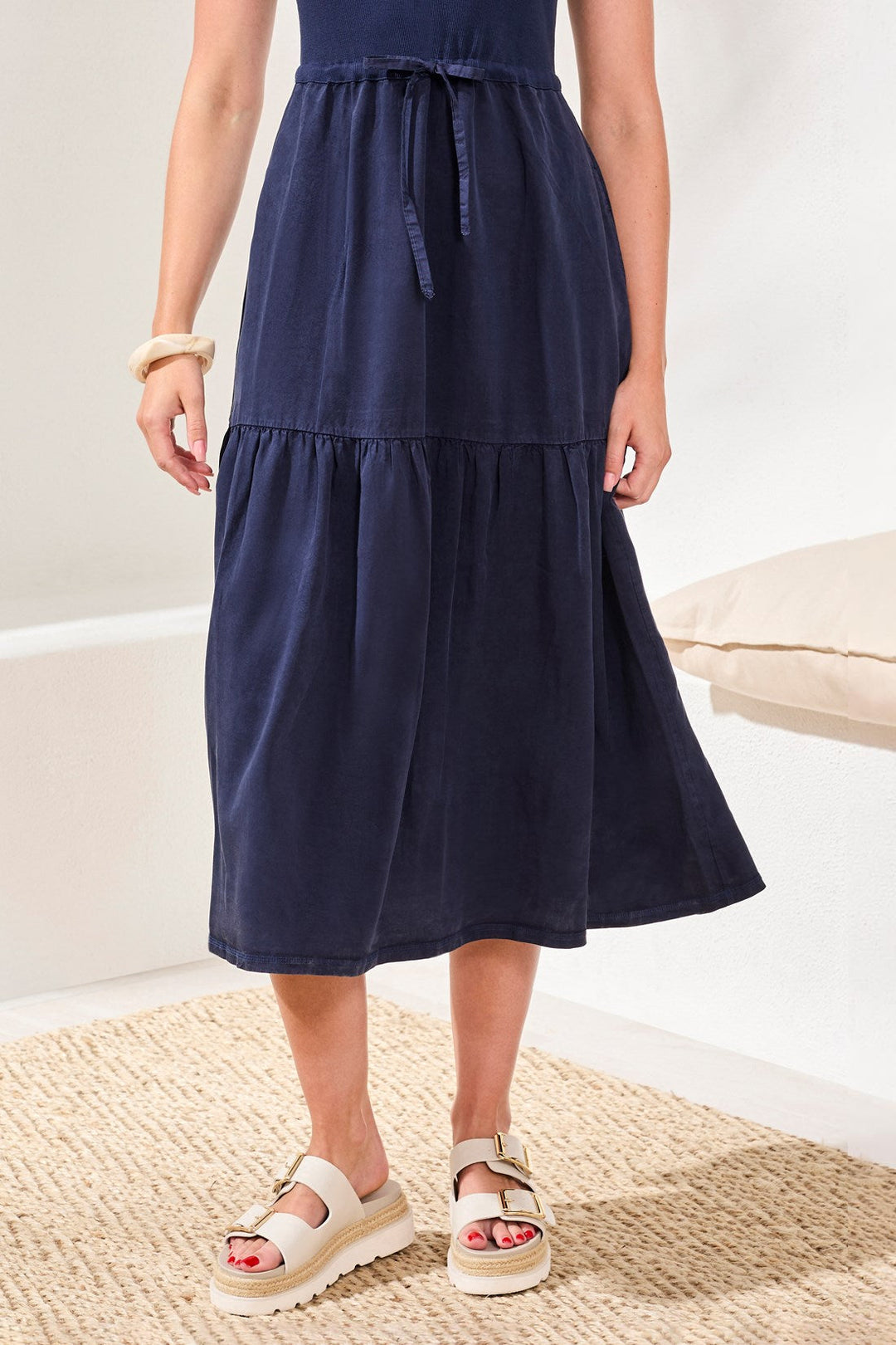 Navy blue mixed media dress with tiered ruffle skirt and drawstring waist