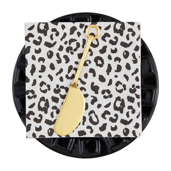 Mud Pie appetizer set with leopard print napkin and gold cheese spreader on black plate