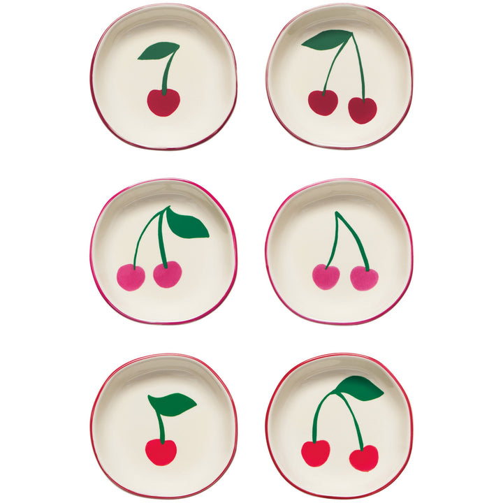 Six cream-colored pinch bowls with red cherry motifs and matching red rim details