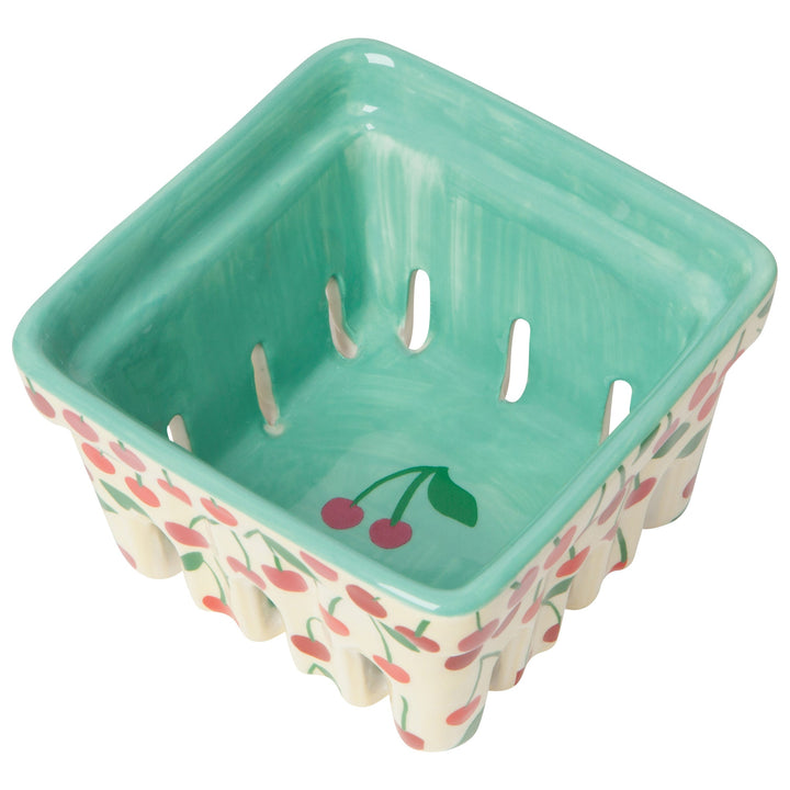 Square ceramic berry basket with mint green interior and cherry pattern exterior